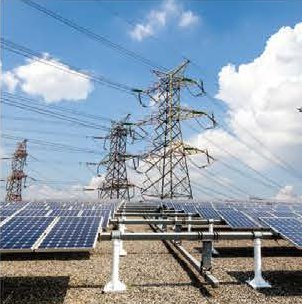 Power transmission towers beside a solar plant