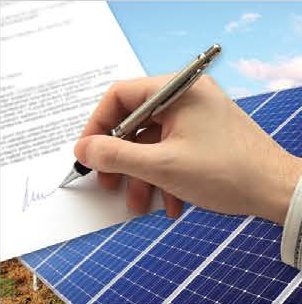 Signing documents for a solar project